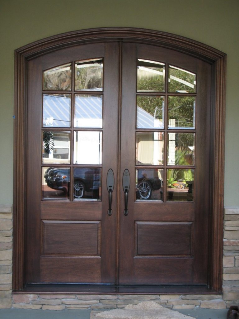 French country double entry doors give charming completions to the