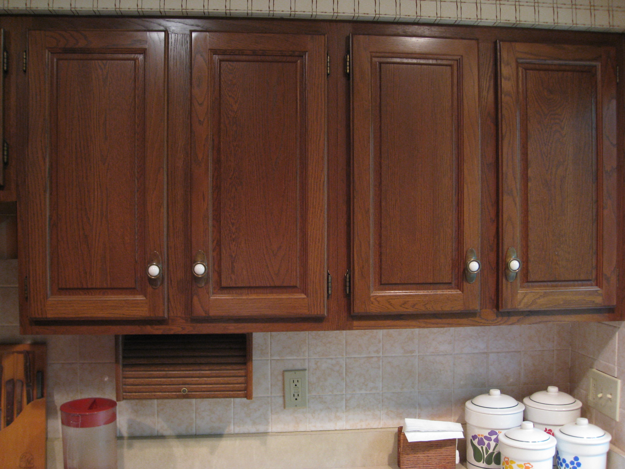 Gel stain over white painted cabinets