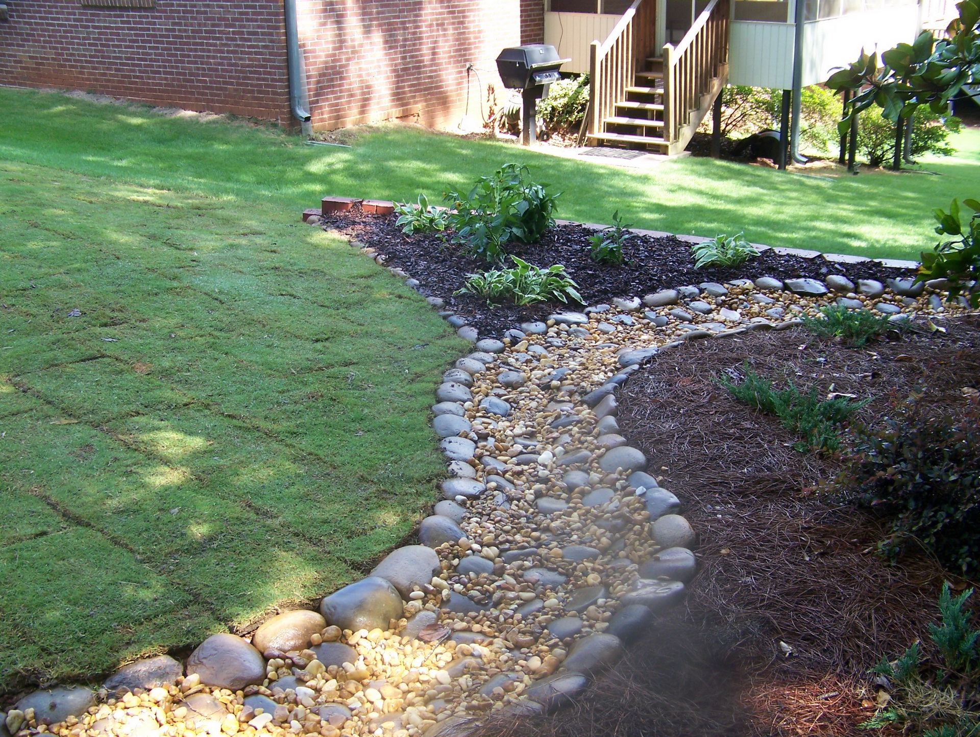 Enhacing Your Landscape River rock garden path