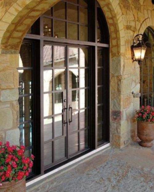 French country double entry doors give charming ...